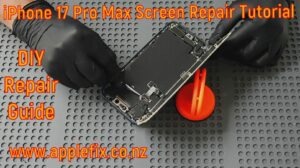 iPhone 17 Pro Max screen replacement repair in progress showing the OLED display being removed during professional smartphone repair. Technician using specialized tools to perform a cracked screen replacement and display repair at AppleFix Hamilton New Zealand, demonstrating the disassembly process for an iPhone 17 Pro Max OLED screen repair and device restoration.