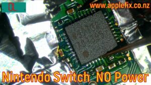 Nintendo Switch OLED no power repair showing M92T36 USB-C power management IC replacement under a microscope. Featured image highlights advanced Nintendo Switch motherboard diagnostics, microsoldering repair, charging circuit troubleshooting, and board-level repair for a Nintendo Switch OLED that would not turn on or charge. Professional Nintendo Switch repair service by AppleFix & Tech Engineers Hamilton, Waikato, New Zealand, specializing in Nintendo Switch no power repair, charging port repair, USB-C repair, motherboard repair, and microsoldering.